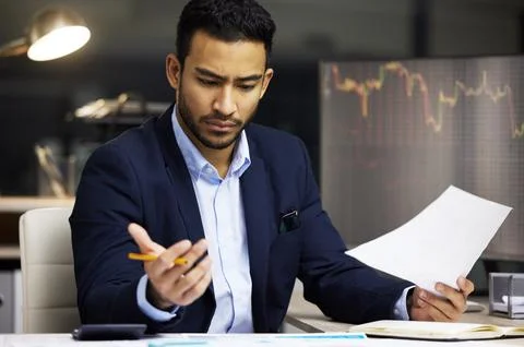 Man, computer screen and stress with graph at desk for investment risk, mistake Stock Photos