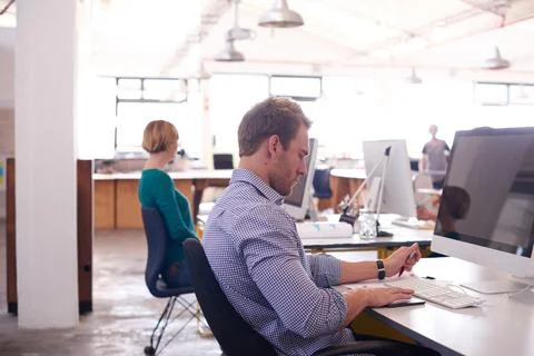 Man, computer screen and tablet in office for networking, email and business Foto stock
