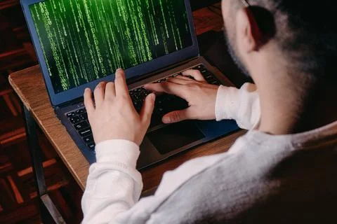 Man with computer screen with green binary matrix binary Stock Photos