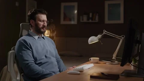 Man at computer sees something disgusting on monitor screen. Disgust concept Video stock 337645804