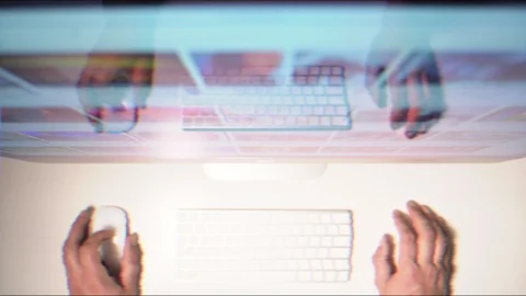 Man at the computer studded with images Stock Footage 127714429
