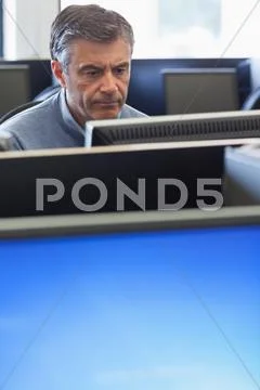 Man concentrating at computer Stock Photos