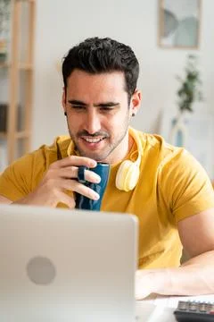Man concentrating while working from home. Stock Photos