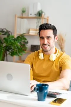 Man concentrating while working from home. Stock Photos