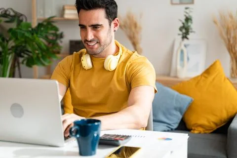 Man concentrating while working from home. Stock Photos
