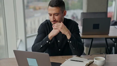 Man with concerned expression on his face looking at laptop.  Stock-Footage 219911098