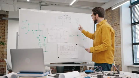 Man conducts online courses on developing modern devices Stock Footage 219866737