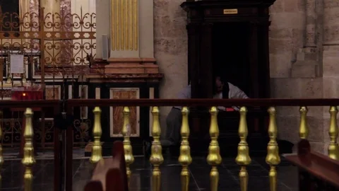 Man in confession inside Valencia Cathedral Stock Footage 78037482