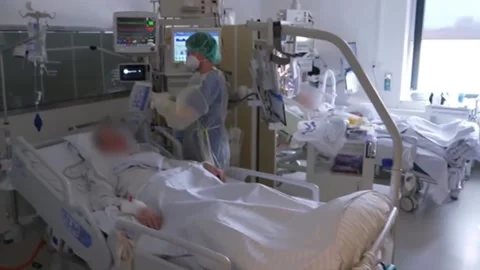 The man is connected to a ventilator. Mutating covid. 1 Stock Footage 152738779