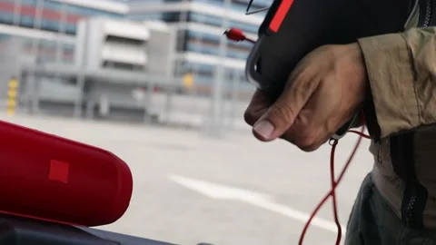 Man is connecting his smartphone with wireless speaker while being charging. Stock Footage 157590296