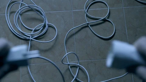 A man connects a cable and the light comes on Stock Footage 129237859