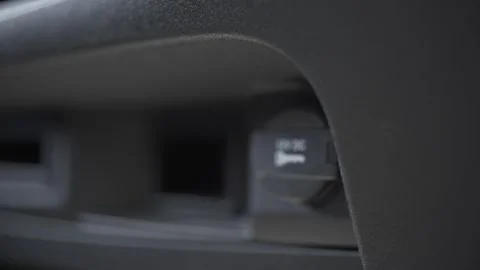 A man connects a gadget to a car, close-up Stock Footage 280967546