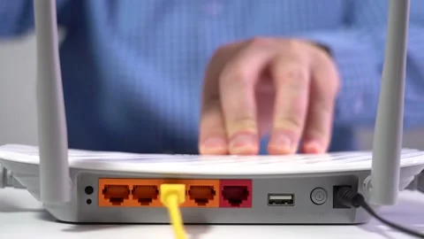 Man Connects Lan Cable to Router. Router Wireless. Close-up Stock Footage 156997464