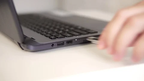 Man connects usb flash drive to a laptop. Stock Footage 112292494