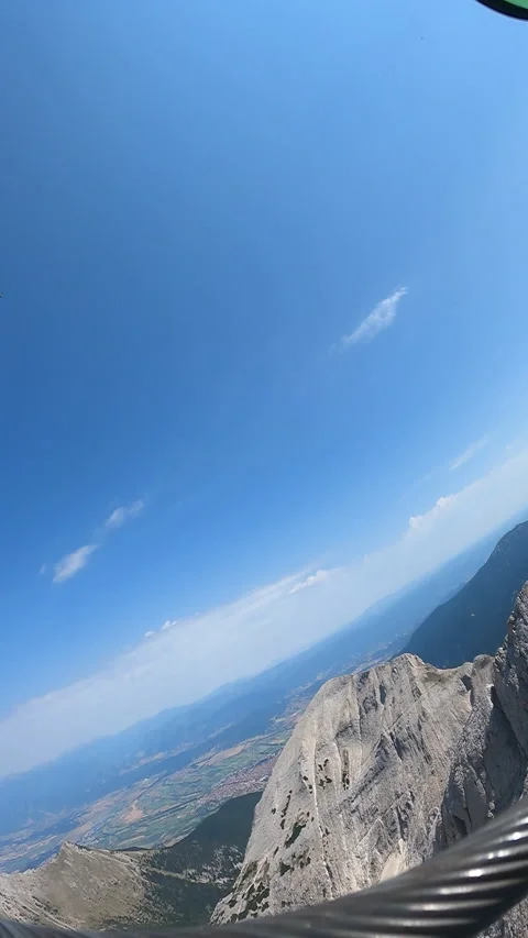 Man conquering sheer rock faces on an extreme  스톡 동영상 262742482
