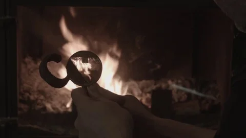 A man considers ancient ironware Stock Footage 74196480