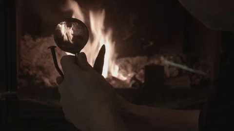 A man considers ancient ironware Stock Footage 74196593