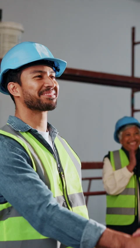 Man, construction and handshake at worksite with applause, achievement and Stock Footage 342313745