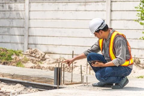 Man construction engineer at construction site 스톡 사진