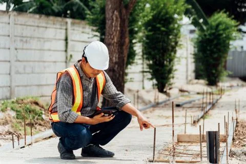 Man construction engineer at construction site Stock Photos
