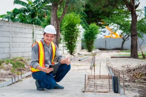 Man construction engineer at construction site 스톡 사진