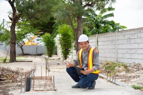 Man construction engineer at construction site Stock Photos