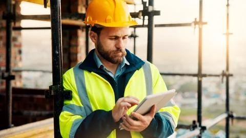 Man, construction or civil engineering with tablet on rooftop site for building Stock Photos