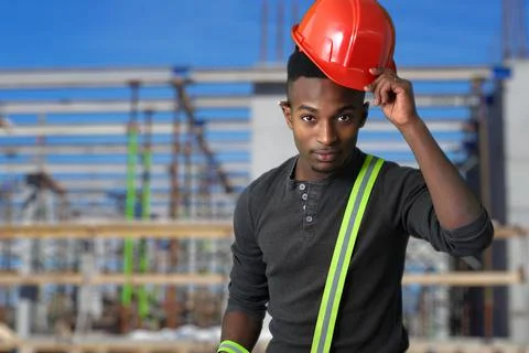 Man on construction site red hat security helmet safety working protective eq Stock Photos