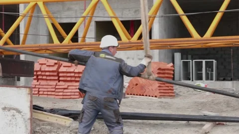 A man at a construction site takes iron 10.06.2020 Stock Footage 132494060