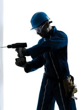 Man construction worker holding drill silhouette Stock Photos