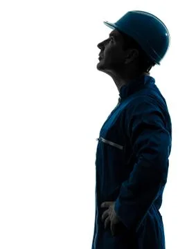 Man construction worker looking up profile silhouette portrait Stock Photos
