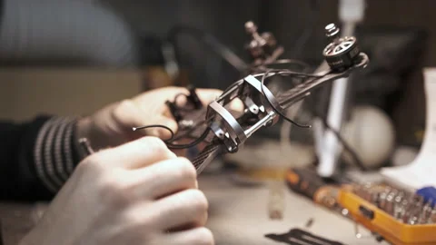 Man constructs a FPV drone from parts Stock Footage 139538127