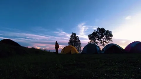 Man contemplating alone araound his solo camping tents at bromo mountain forest  Stock Footage 230965102