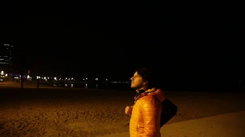 Man contemplating the city at night Stock Footage 104123544