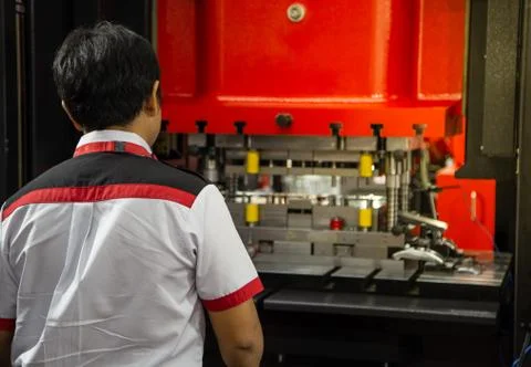 Man control hydraulic press machine Stock Photos
