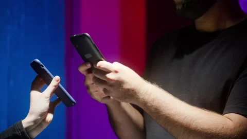 Man controller scanning QR code on smartphone, nightclub security. Covid Stock Footage 166103003
