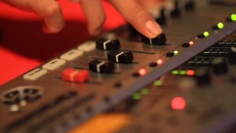 Man controlling an audio mixer Stock Footage 233656212