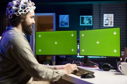Man controlling computer functions using mind, helped by mockup notebook 스톡 사진