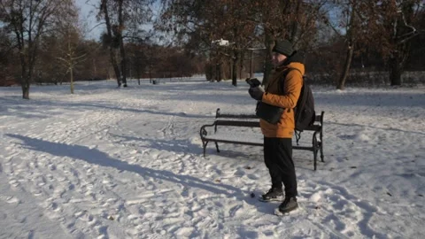 The man is controlling the drone with smartphone Stock Footage 265141121