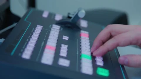 A man controlling an electronic device with a green and red buttons Stock Footage 276662571