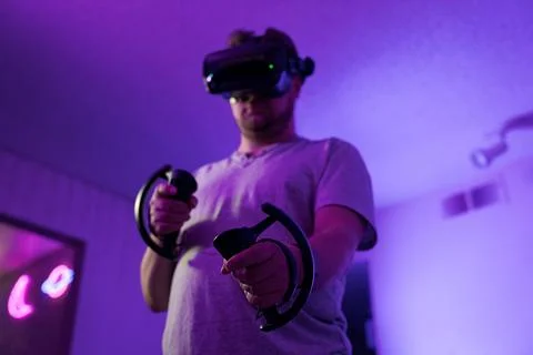 Man controlling gameplay in virtual reality environment Stock Photos