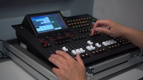 Man controlling professional lighting mixer using stylus 4k 스톡 동영상 331285164