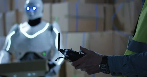 Man controlling a robot Stock Footage 108123774