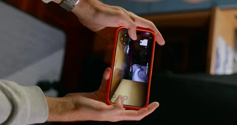 Man Controlling A Smart Home Robot With A Smartphone App. Vertical Stock Footage 327342166