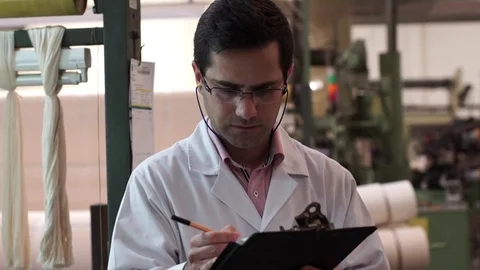 Man controlling textile factory process. Stock Footage 72590393