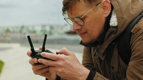 Man controls the drone outdoors. Stock Footage 108474361