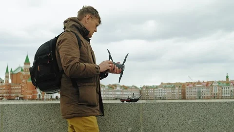 Man controls the drone outdoors. Stock Footage 108474968