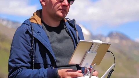 Man controls a drone with a remote control Stock Footage 79271637