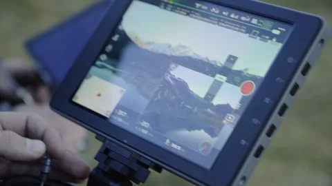 Man controls a drone through a remote control and glasses. Stock Footage 120933777