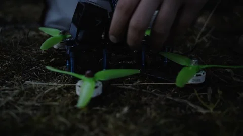 Man controls a drone through a remote control and glasses. Stock Footage 120934009